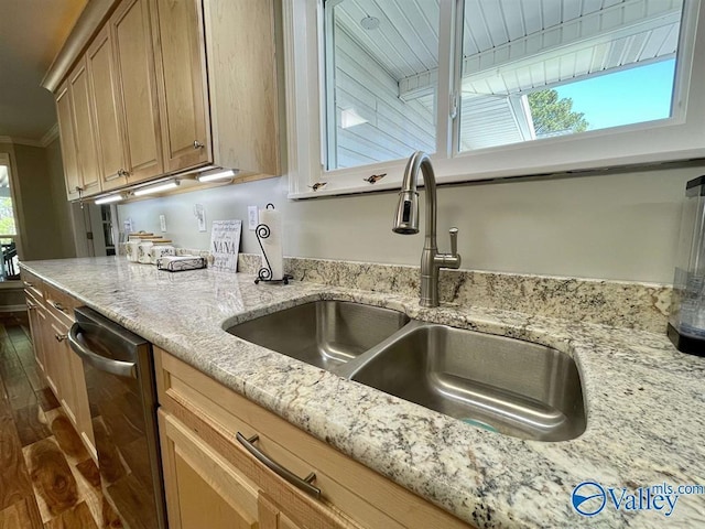 kitchen with dark wood finished floors, light stone countertops, ornamental molding, dishwasher, and a sink