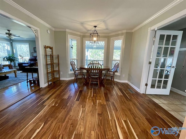 dining area featuring visible vents, baseboards, plenty of natural light, and wood finished floors