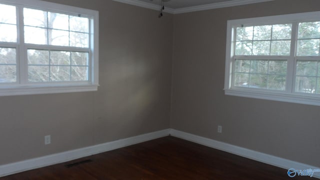 unfurnished room featuring dark hardwood / wood-style flooring and crown molding