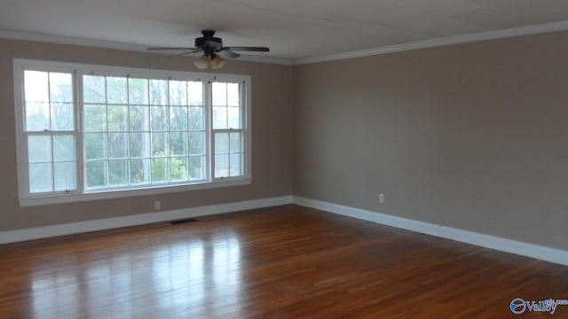 unfurnished room with hardwood / wood-style flooring, ceiling fan, and crown molding