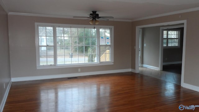 unfurnished room featuring ceiling fan, dark hardwood / wood-style floors, and crown molding