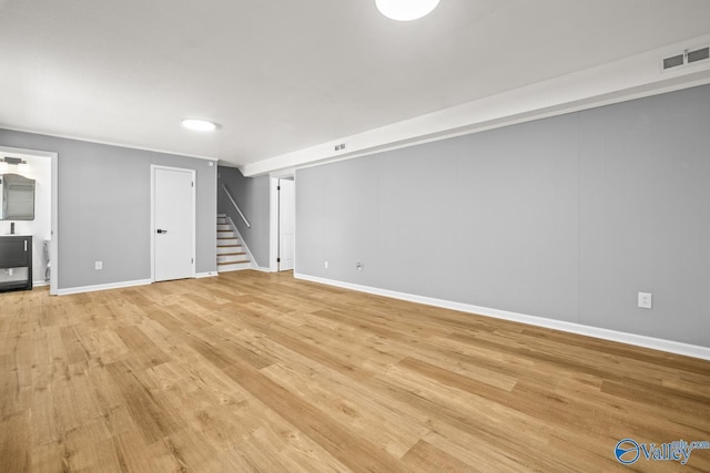 10012 Allison Dr, Huntsville, AL 35803 - unfurnished living room featuring stairway, light wood-type flooring, and baseboards