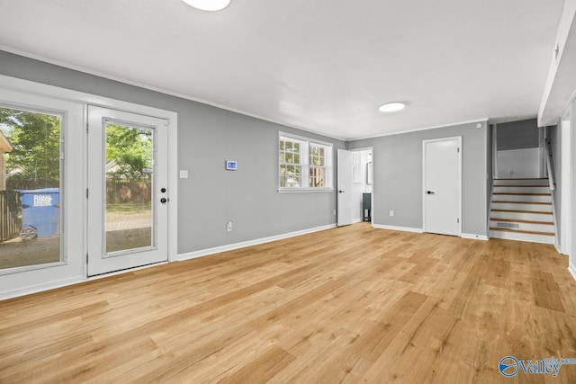 10012 Allison Dr, Huntsville, AL 35803 - unfurnished living room with stairs, light wood-style floors, baseboards, and ornamental molding