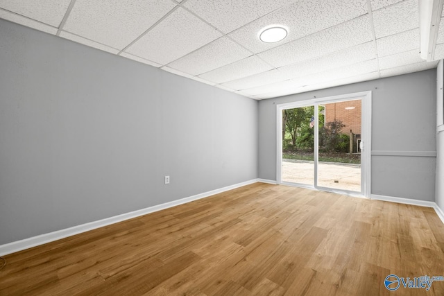 10012 Allison Dr, Huntsville, AL 35803 - unfurnished room with a drop ceiling, light wood-type flooring, and baseboards