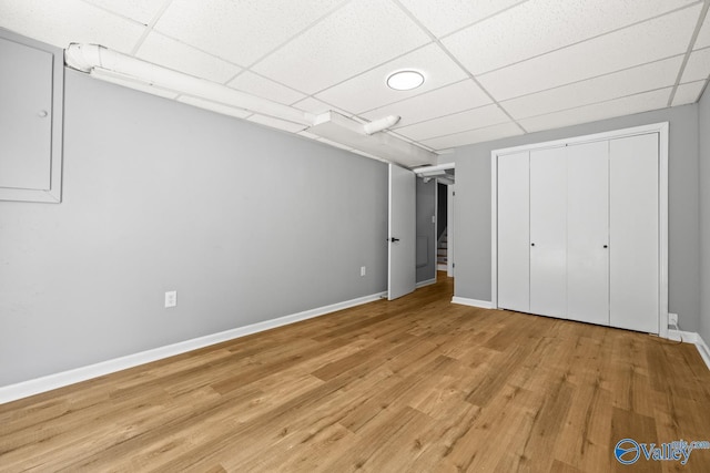 10012 Allison Dr, Huntsville, AL 35803 - unfurnished bedroom with wood finished floors, a drop ceiling, baseboards, and a closet