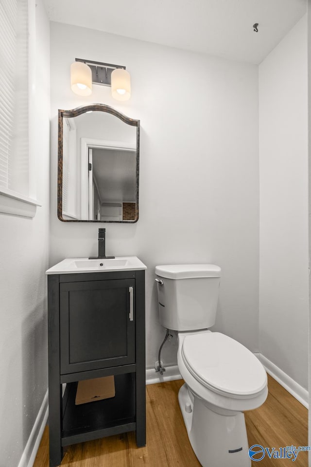 10012 Allison Dr, Huntsville, AL 35803 - bathroom with wood finished floors, baseboards, and vanity
