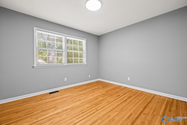 10012 Allison Dr, Huntsville, AL 35803 - empty room with baseboards and wood finished floors