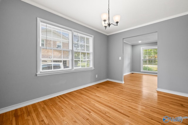10012 Allison Dr, Huntsville, AL 35803 - empty room with a chandelier, baseboards, light wood-style floors, and ornamental molding