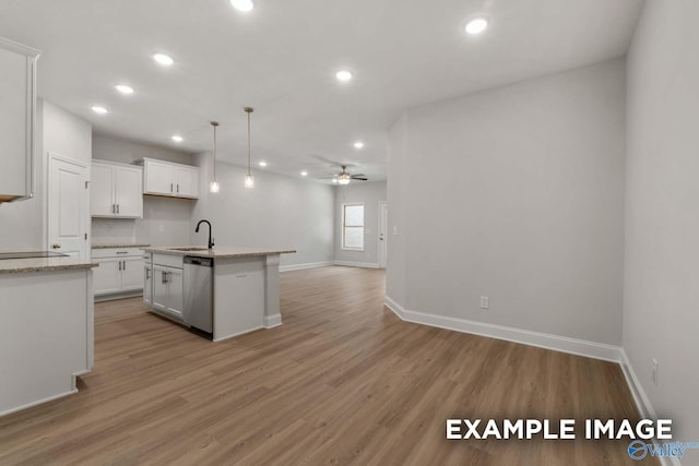 433 Lando Cain Rd, Hartselle, AL 35640 - kitchen featuring open floor plan, a sink, stainless steel dishwasher, recessed lighting, and baseboards