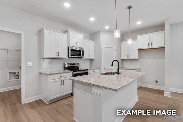 433 Lando Cain Rd, Hartselle, AL 35640 - kitchen with stainless steel appliances, a sink, light wood-type flooring, baseboards, and recessed lighting