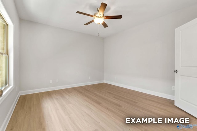 433 Lando Cain Rd, Hartselle, AL 35640 - spare room featuring ceiling fan, light wood finished floors, and baseboards