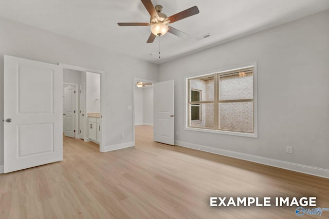 433 Lando Cain Rd, Hartselle, AL 35640 - unfurnished bedroom with light wood-style floors, baseboards, ensuite bathroom, and ceiling fan
