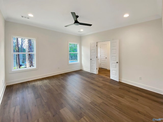 unfurnished bedroom with dark wood-type flooring, ornamental molding, and ceiling fan