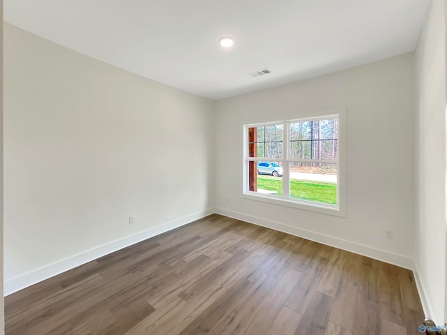 unfurnished room featuring wood-type flooring