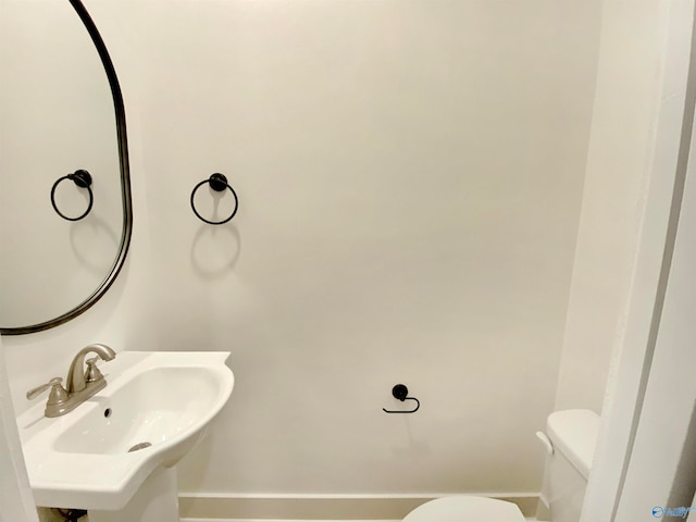 bathroom with sink and toilet