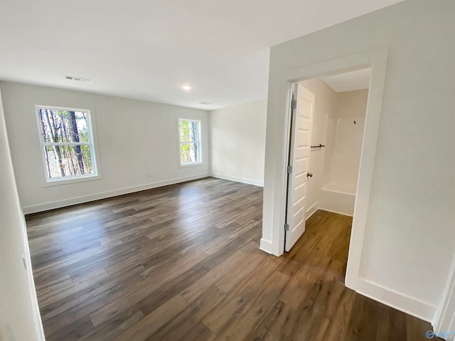 unfurnished room featuring dark hardwood / wood-style floors