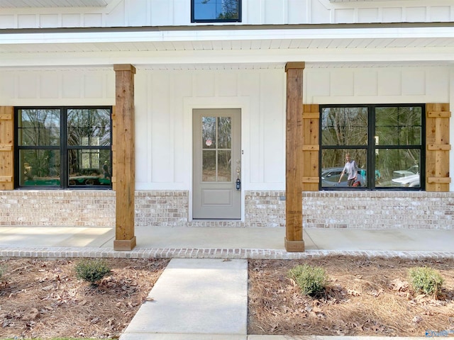 doorway to property featuring a porch