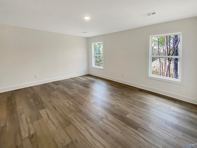 spare room featuring dark hardwood / wood-style floors