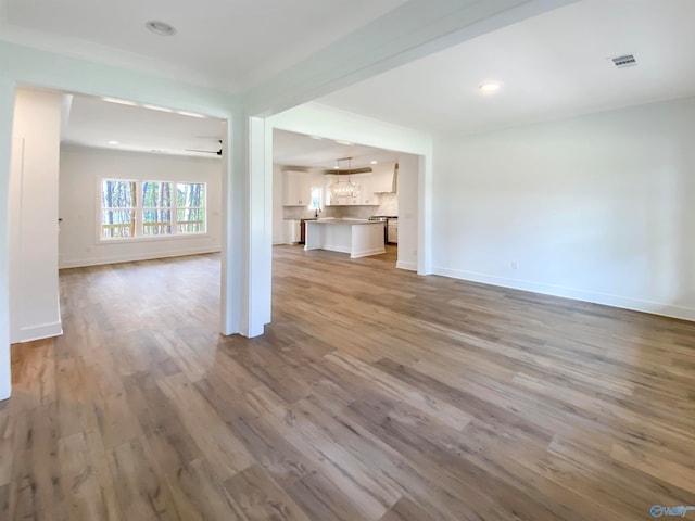 unfurnished living room with light wood-type flooring