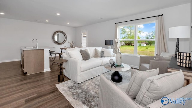 18891 Wicklow Cir, Athens, AL 35613 - living area with dark wood-type flooring, baseboards, and recessed lighting