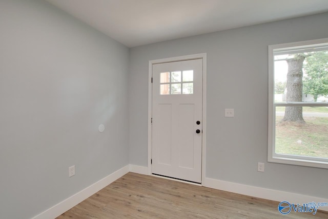 3913 Pine Ave SW, Huntsville, AL 35805 - foyer with baseboards and light wood-type flooring