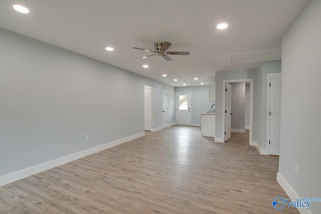 3913 Pine Ave SW, Huntsville, AL 35805 - spare room with baseboards, a ceiling fan, attic access, and light wood-type flooring