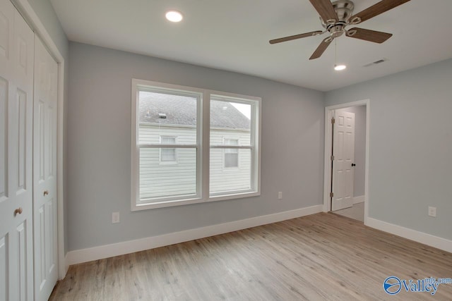 3913 Pine Ave SW, Huntsville, AL 35805 - unfurnished bedroom featuring baseboards, a closet, and light wood finished floors