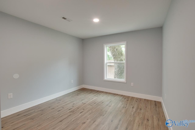 3913 Pine Ave SW, Huntsville, AL 35805 - spare room with baseboards, recessed lighting, light wood-style flooring, and visible vents