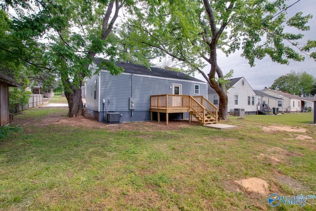 3913 Pine Ave SW, Huntsville, AL 35805 - back of property featuring fence, central air condition unit, a deck, stairway, and a lawn