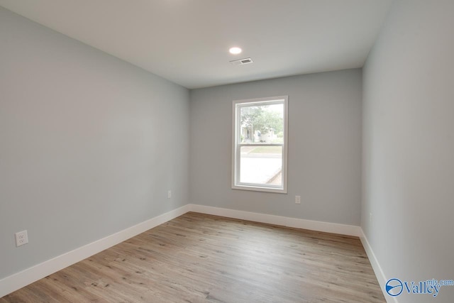 3913 Pine Ave SW, Huntsville, AL 35805 - spare room featuring baseboards, light wood-style flooring, and visible vents