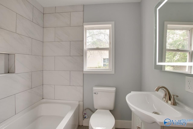 3913 Pine Ave SW, Huntsville, AL 35805 - full bathroom with vanity, shower / bathtub combination, a healthy amount of sunlight, and toilet