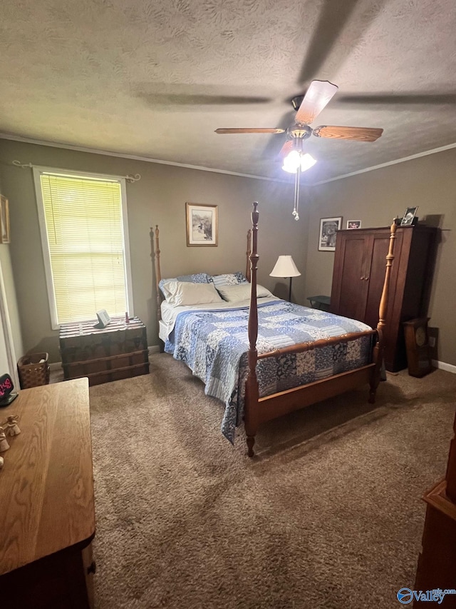 bedroom featuring a textured ceiling, carpet floors, and ceiling fan