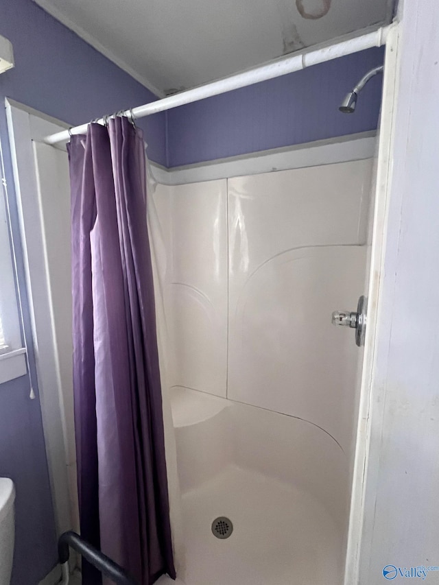 bathroom with a shower with curtain