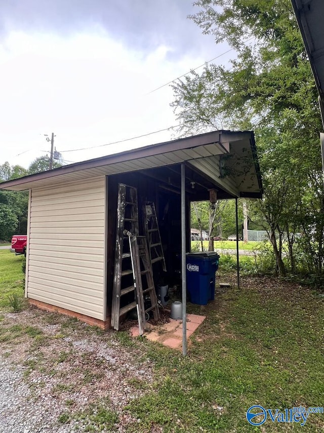 view of outbuilding with a yard