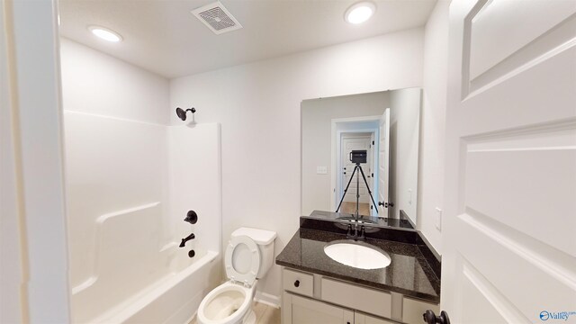 full bathroom featuring shower / tub combination, vanity, and toilet