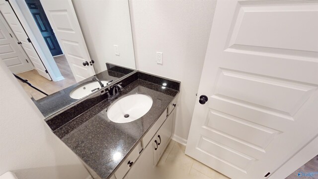 bathroom featuring tile patterned floors and vanity