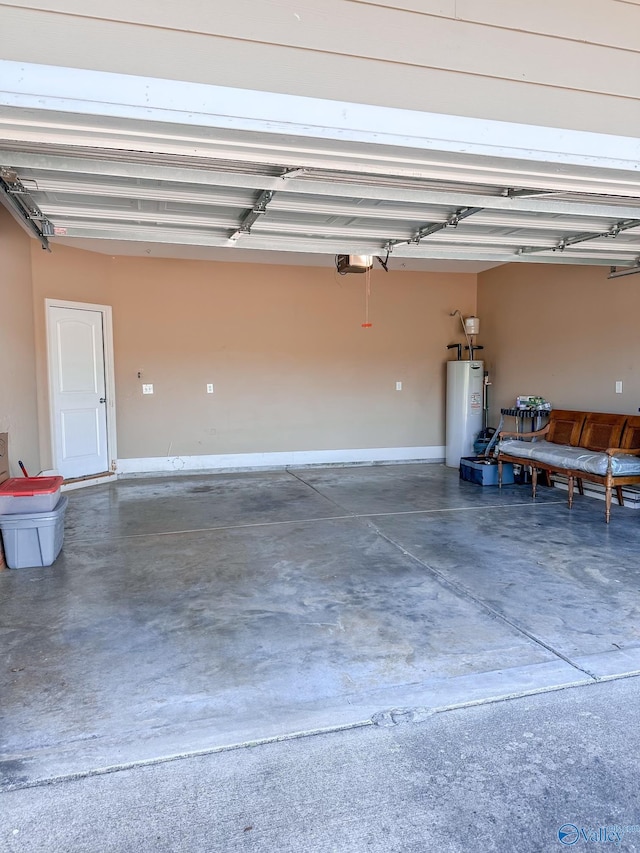 garage featuring water heater and a garage door opener