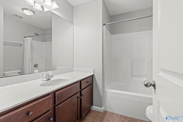 bathroom featuring tile patterned flooring, vanity, and toilet