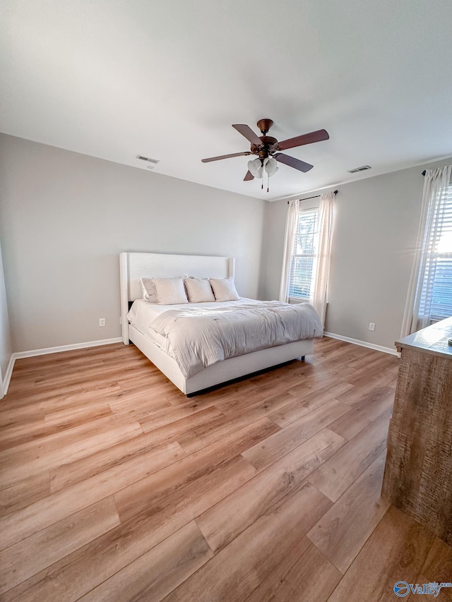 bedroom featuring light hardwood / wood-style flooring and ceiling fan