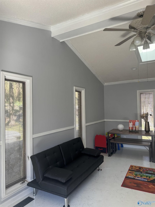 interior space featuring ceiling fan, a textured ceiling, ornamental molding, and vaulted ceiling