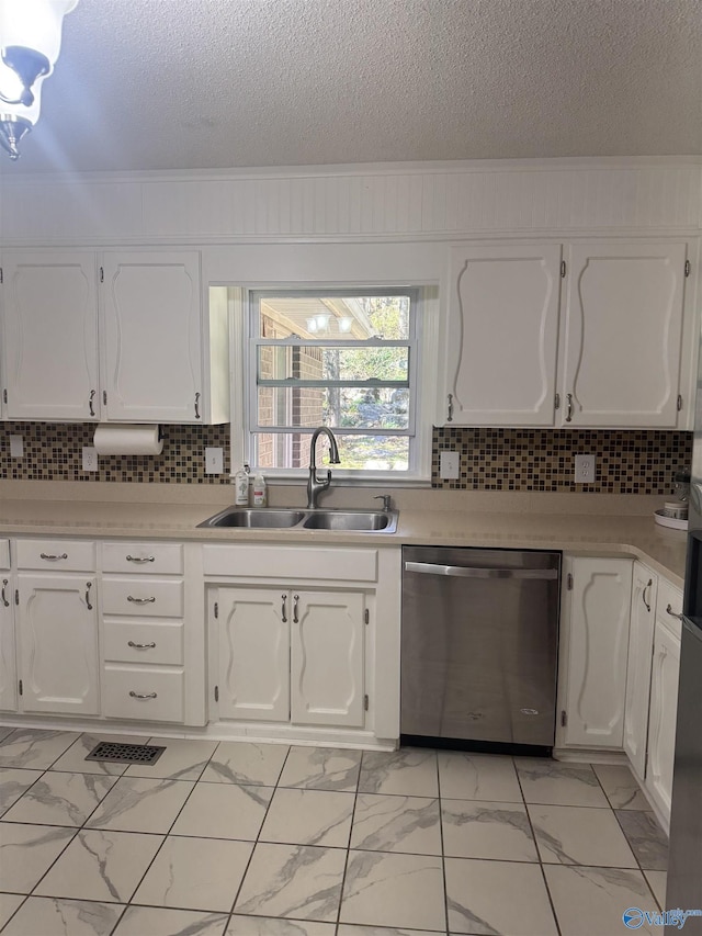 kitchen featuring white cabinetry, a sink, light countertops, dishwasher, and marble finish floor