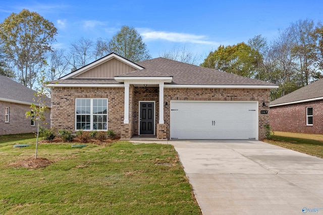 view of front facade with a garage and a front lawn