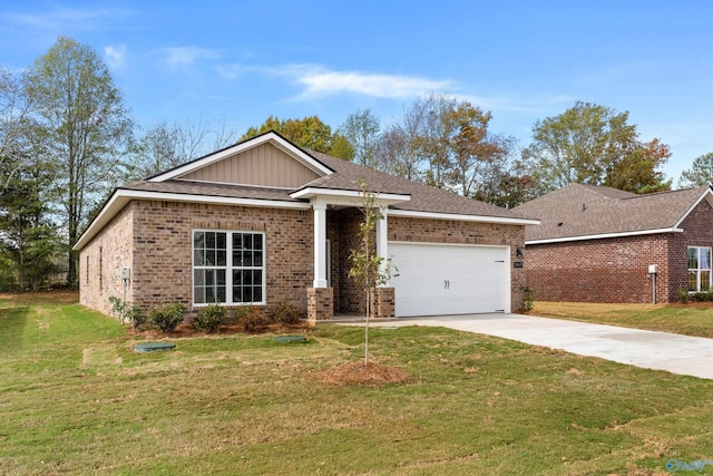 view of front of property featuring a garage and a front yard