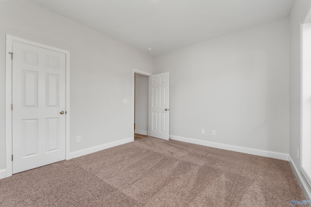 unfurnished room with carpet