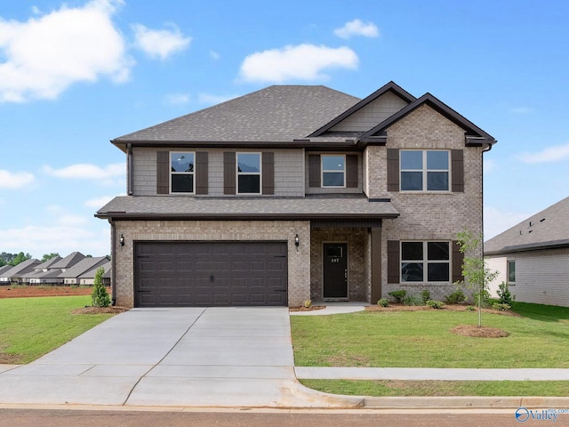 craftsman-style house featuring a front lawn and a garage