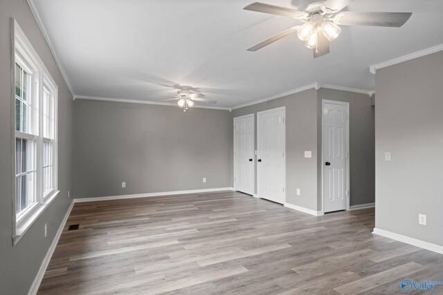 127 Patdean Dr, Huntsville, AL 35811 - unfurnished bedroom with wood finished floors, ornamental molding, and a ceiling fan