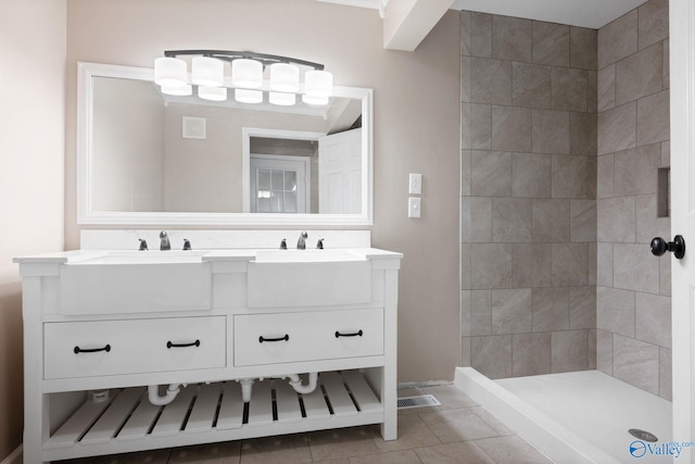 127 Patdean Dr, Huntsville, AL 35811 - bathroom with double vanity, tile patterned floors, and a tile shower