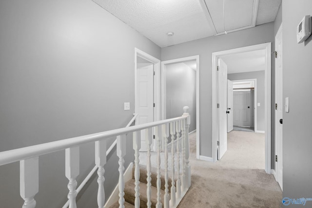 127 Patdean Dr, Huntsville, AL 35811 - hallway featuring an upstairs landing, carpet floors, attic access, and a textured ceiling