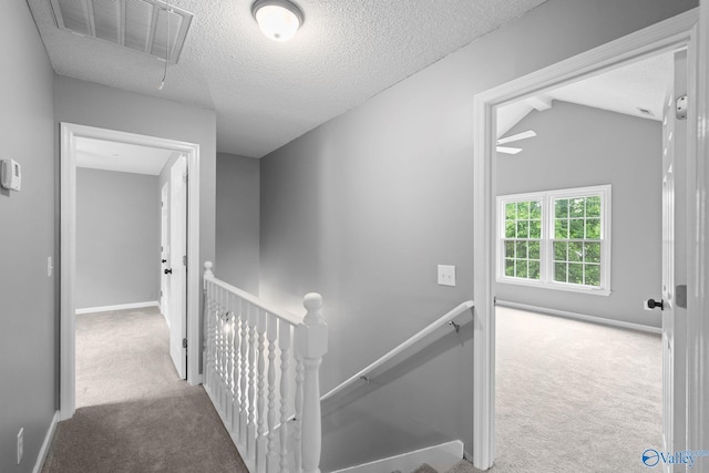 127 Patdean Dr, Huntsville, AL 35811 - corridor with an upstairs landing, carpet, attic access, and a textured ceiling