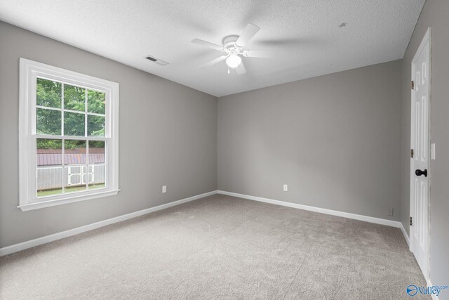 127 Patdean Dr, Huntsville, AL 35811 - unfurnished room featuring carpet, ceiling fan, and a textured ceiling